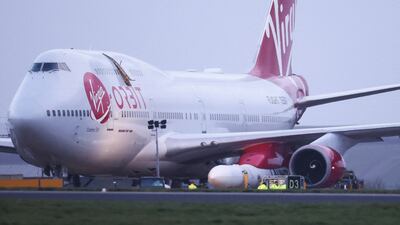A Virgin Boeing 747-400 aircraft sits on the tarmac, with Virgin Orbit's LauncherOne rocket attached to the wing, ahead of the first UK launch at Newquay Airport in Britain in January. Reuters