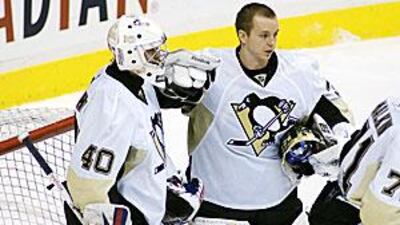 Alexander Pechurski, left, receives congratulations after his debut for the Penguins.