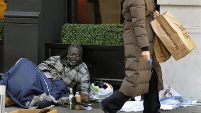 Homeless people often need clothes that would make them appear less threatening to people who are afraid of the sight of poverty and suffering. Timothy A Clary / AFP