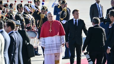 Pope Leo XIV with the French President Emmanuel Macron at Paris Orly Airport. AFP