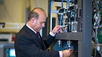 Masdar Institute Center of Excellence for Water Technologies director Dr Nidal Hilal examining his ongoing desalination membrane technology experiment. Courtesy of Masdar Institute