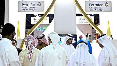 Visitors attend a career fair in Dubai in March. The private sector has been urged to help more Emiratis to get into the workforce. Jeff Topping / The National