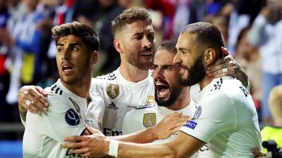 Benzema celebrates with teammates after scoring Madrid's first goal. Getty
