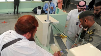 A Muslim man is checked by security as the first pilgrims for the annual Haj pilgrimage arrive in Jeddah on July 24, 2017. AFP / Amer Hilabi