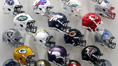 NFL team helmets are displayed at the NFL Headquarters in New York, in this file photo taken December 3, 2015. A top NFL official acknowledged for the first time on Monday a link between football-related concussions and chronic traumatic encephalopathy (CTE), the degenerative brain condition caused by repeated blows to the head. REUTERS/Brendan McDermid/Files