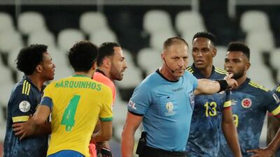 Colombia players remonstrate with referee Nestor Pitana after a Brazil goal. Reuters