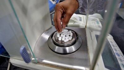 A pharmacist checks weight of Paracetamol, a popular palliative, in a lab in Ahmedabad, India, in March 2020. Indian pharma businesses are preparing to lock horns with the Trump administration over tariffs. Reuters