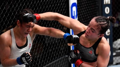 Maycee Barber, right, punches Alexa Grasso of Mexico in their flyweight fight during the UFC 258 event at UFC APEX in Las Vegas, Nevada. Jeff Bottari / Zuffa LLC / UFC