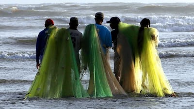 Fishermen prepare to fish at the beach in Karachi, Pakistan. EPA