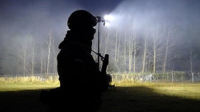 Polish soldiers patrol the border near Kuznica, Poland. Reuters
