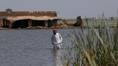 A man in front of a house damaged by devastating rains and floods in Pakistan. Egypt wants to include compensation for countries that experience economic losses caused by climate change in the Cop27 agenda. Reuters