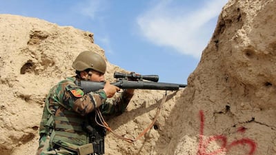 An Afghan soldier takes position while fighting Taliban militants in Bolan area of Helmand province on October 29, 2016. Watan Yar / EPA