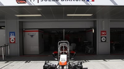 Marussia will keep Jules Bianchi’s nameplate above their garage at Sochi even though Alexander Rossi will be in the car. Luca Bruno / AP Photo