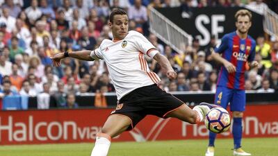 Valencia player Rodrigo Moreno scores the team’s second goal against Barcelona. Biel Alino / EPA