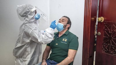 A UK study has found three quarters of people were asymptomatic when they were tested. Victor Besa / The National