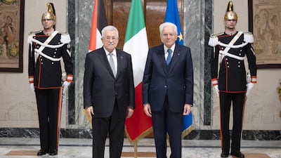Italian President Sergio Mattarella welcomes Mr Abbas before their meeting at his official residence, the Quirinale Palace, in Rome. EPA