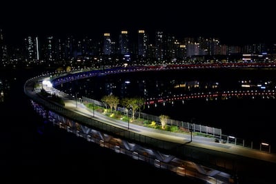 The circular Geumgang Pedestrian Bridge in Sejong City at night. Alamy Stock Photo