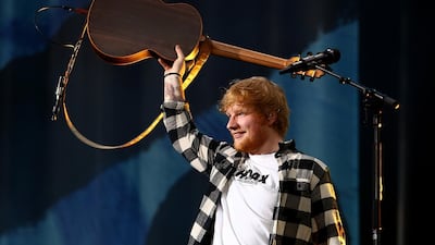 Ed Sheeran gave the England cricket team a lift by visiting their dressing room during the second day of the first Test in Auckland. Paul Kane / Getty Images