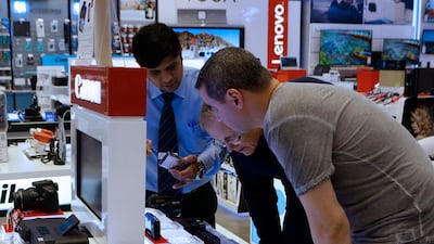 Value Added Tax will affect electronic items such as these digital cameras, at Jacky's Electronics shop in Dubai mall. Jeffrey E Biteng / The National