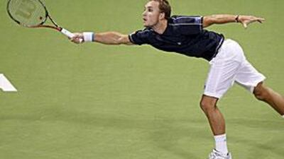 Steve Darcis shows a rare moment of flexibility during his defeat to Rafael Nadal yesterday. Darcis was forced to retire through injury.