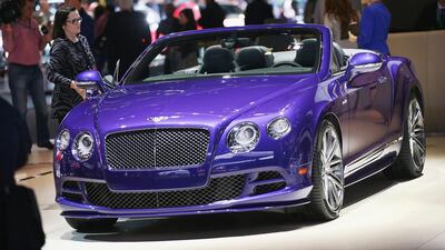 Bentley shows off their GTS Speed convertible at the North American International Auto Show in Detroit. The new Bentley GT Speed convertible reaches 203 mph while the coupe reaches a top speed of 206 mph – the fastest production Bentley ever. Scott Olson / Getty Images / AFP
