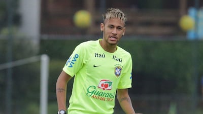 Brazilian Neymar takes part in a training session at the squad's Granja Comary training complex in Teresopolis, Brazil on Sunday, June 15, 2014. Ari Versiani / AFP