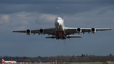 An Emirates Airbus A380 passenger jet prepares to land at Gatwick Airport. AFP
