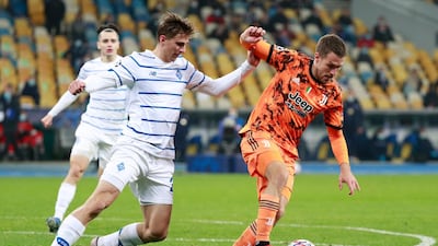 Juventus midfielder Aaron Ramsey, right, under pressure form Dynamo Kiev's Illya Zabarnyi. AP