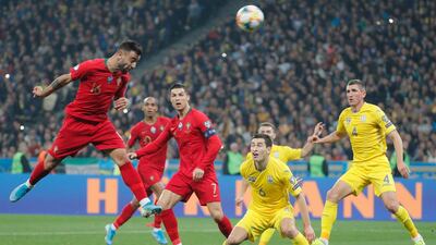 epa07920937 Bruno Fernandes (L) of Portugal and Taras Stepanenko (C-R) of Ukraine in action during the UEFA Euro 2020 qualifying, group B, soccer match between Ukraine and Portugal in Kiev, Ukraine, 14 October 2019. EPA/SERGEY DOLZHENKO