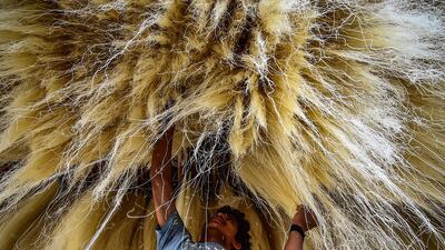 A worker stacks vermicelli which is used in making traditional sweet dishes popularly consumed during the holy month, at a factory in Allahabad, India. AFP