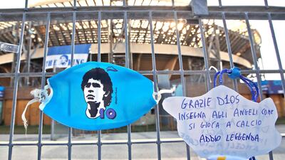 A sign reads "Thank you god, teach the angels how to play football, farewell legend" is seen on the gates of the San Paolo stadium in Naples. AP Photo