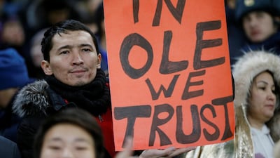 A fan displays a sign in reference to Manchester United manager Ole Gunnar Solskjaer before the Europa League match against Astana. Reuters