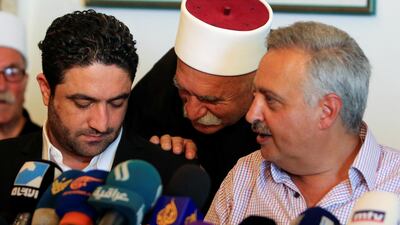 Saleh Gharib, left, the Lebanese minister for refugee affairs, with Druze politician Talal Arslane at a news conference in Khaldeh, near Beirut, on July 1, 2019. Reuters