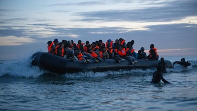 Migrants prepare to sail across the English Channel. Alleged Kurdish mafia bosses who run smuggling gangs should be sanctioned, a former Foreign Office adviser has said. Getty