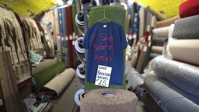 A T Shirt with a message supporting Brixton Arches is sold in a carpet shop under the arches. Shopkeepers and tenants are facing eviction from several of the spaces under the arches. Dan Kitwood / Getty