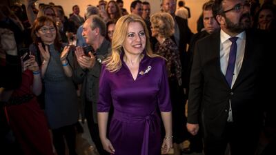 Slovak presidential candidate Zuzana Caputova (C) and her partner Peter Konecny (R) watch results during an elections night at her election headquarters in Slovakia's presidential election run-off in Bratislava, Slovakia, 30 March 2019. EPA