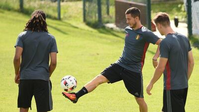 Belgium forward Eden Hazard (C) plays with the ball as he takes part in a training session during the Euro 2016 football tournament at Le Haillan on June 30, 2016. Nicolas Tucat / AFP