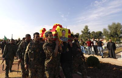 Fighters from the SDF carry the coffin of a fellow fighter killed in fighting on November 11, 2018. AFP