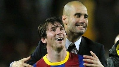 Barcelona's coach Josep Guardiola and Lionel Messi. JAVIER SORIANO / AFP