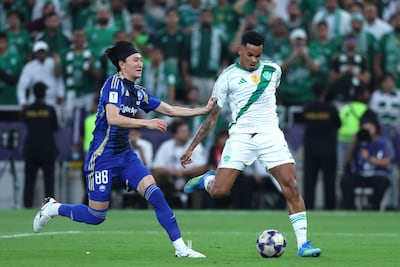 Machida Zelvia's Hotaka Nakamura, left, fights for the ball against Ahli's Galeno. AFP