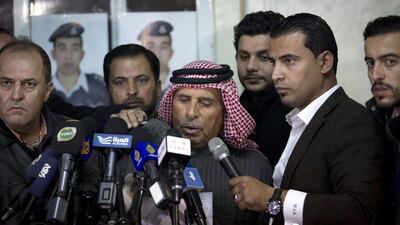 Safi Al Kassasbeh, the father of the Jordanian pilot captured by ISIL, reads a statement urging his son’s captors to have mercy on a fellow Muslim and spare his life, in Amman on January 29, 2015. Nasser Nasser / AP Photo