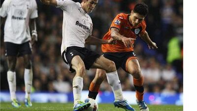 Alejandro Faurlin of Queens Park Rangers, right, battles with Gareth Bale of Tottenham Hotspur.