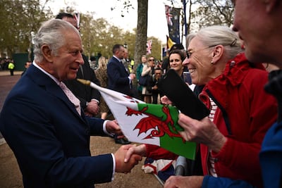 Britain's King Charles III (L) speaks with well-wishers on The Mall near to Buckingham Palace in central London on Friday ahead of the coronation weekend. AFP