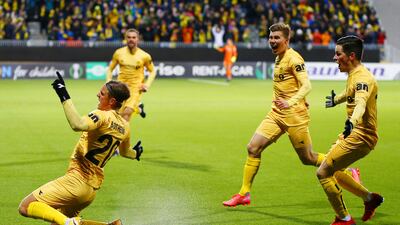Bodo/Glimt's Erik Botheim, left, celebrates with teammates after scoring. AP