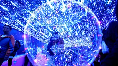 A couple takes selfies inside the "Milky Way tunnel" at the New Taipei City. AFP