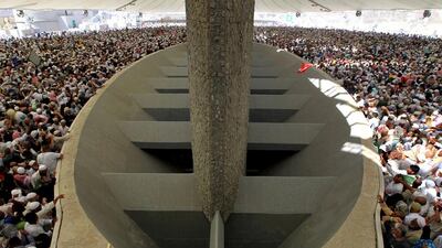 Muslim pilgrims throw stones at the symbolic devil represented by a Jamarat (Burning Coal) during the last day of Hajj. Alaa Badarneh / EPA