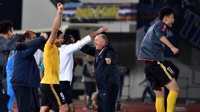 China's Guangzhou Evergrande head coach Luiz Felipe Scolari, centre, celebrates with players after their victory in the Asian Champions League semi-final on Wednesday. Kazuhiro Nogi / AFP / October 21, 2015