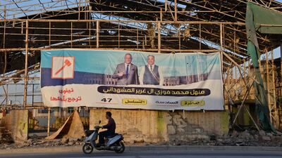 An electoral banner for a candidate is seen in Iraq's second city of Mosul on September 5, 2021, ahead of the October 10 parliamentary elections. AFP