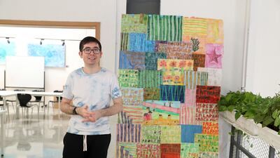 Sean McLennan with one of is large collages. Pawan Singh / The National