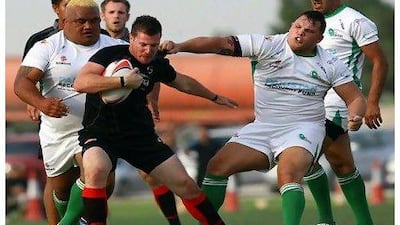 The UAE, in black, came back against a Pakistan side that found a surprising amount of fan support from a people watching a neighboring cricket match, who wandered over to see what all the fuss was about when they heard the Pakistan national anthem being sung prior to the game.